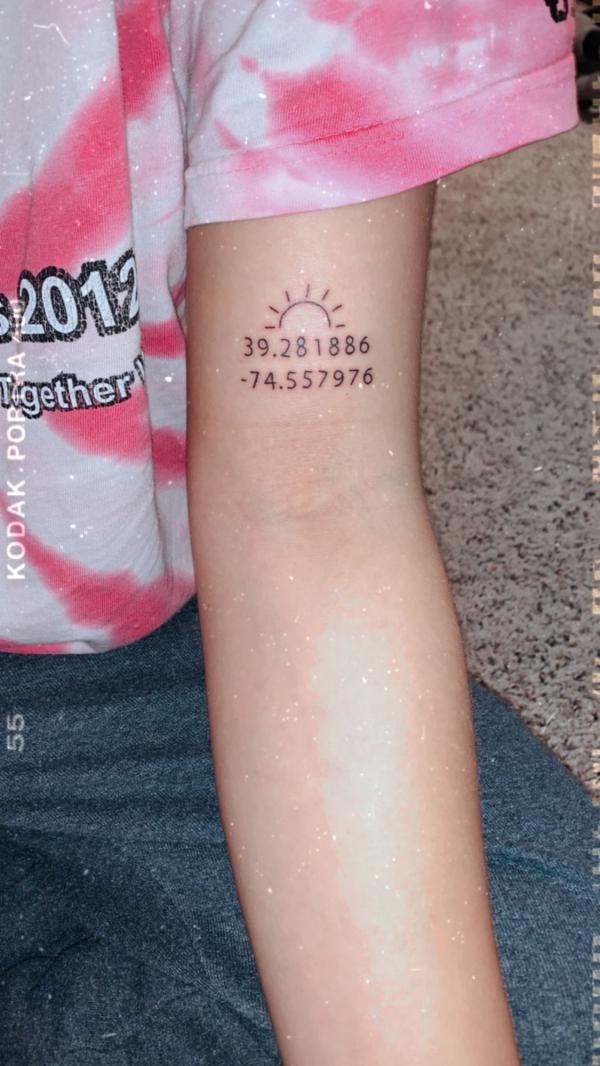 Sun and coordinates tattoo