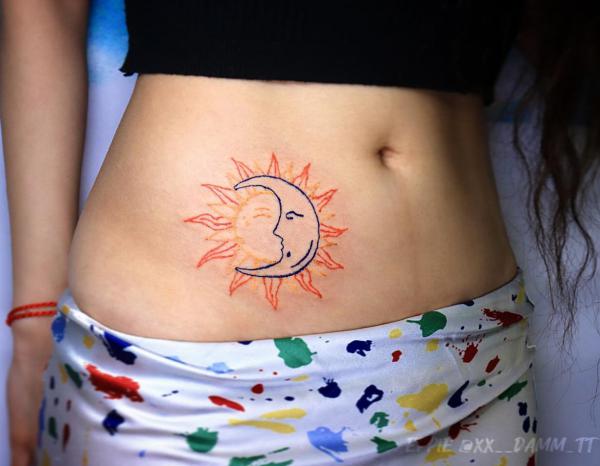 Sun and moon face abdomen tattoo