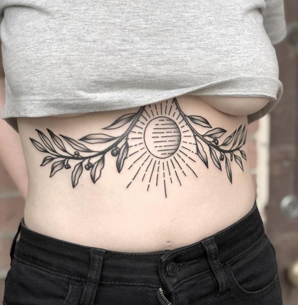 Sun stomach tattoo