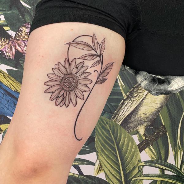 Sunflower Leo thigh tattoo
