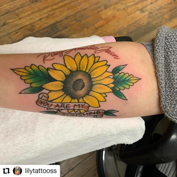 Sunflower with ribbon bearing words You Are My Sunshine tattoo