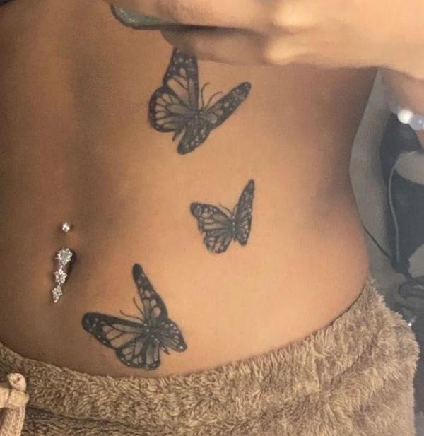 Three butterflies stomach tattoo
