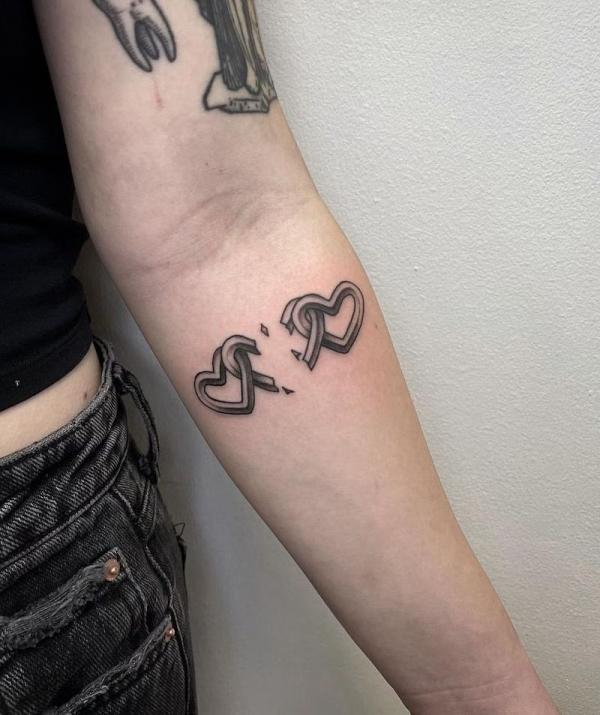 Three hearts with a broken one in the middle