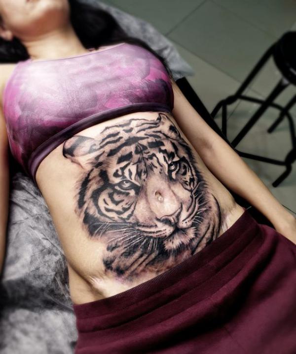 Tiger head stomach tattoo
