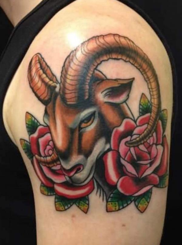 Traditional Aries ram with roses shoulder tattoo