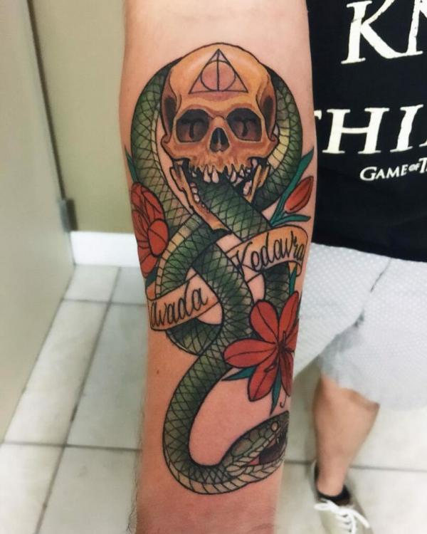 Traditional death eater with flower and words avada kedavra tattoo