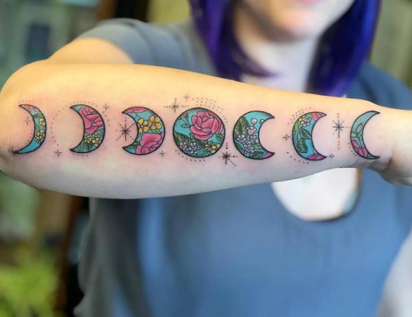 Traditional floral Moon phases tattoo