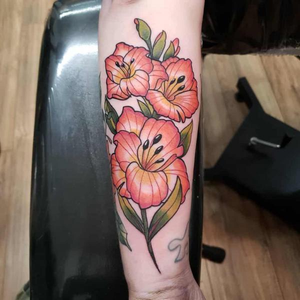 Traditional gladiolus forearm tattoo