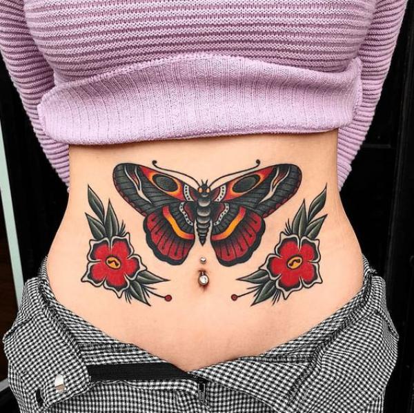 Traditional moth and flowers abdomen tattoo