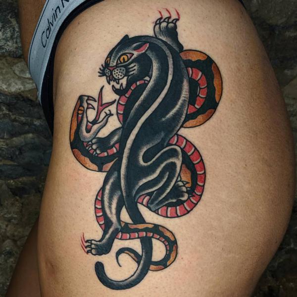 Traditional panther and snake tattoo on the side of hip