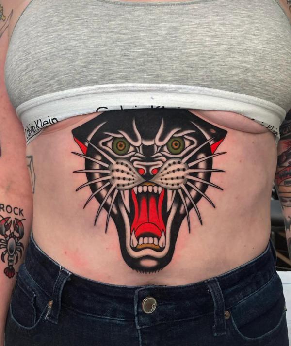 Traditional panther head abdomen tattoo