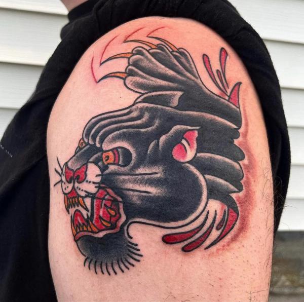 Traditional panther head and claw shoulder tattoo