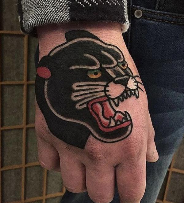 Traditional panther head hand tattoo