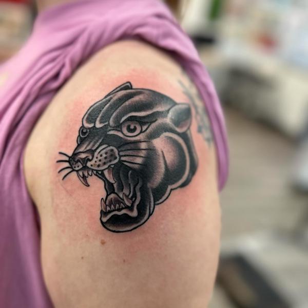 Traditional panther head shoulder tattoo