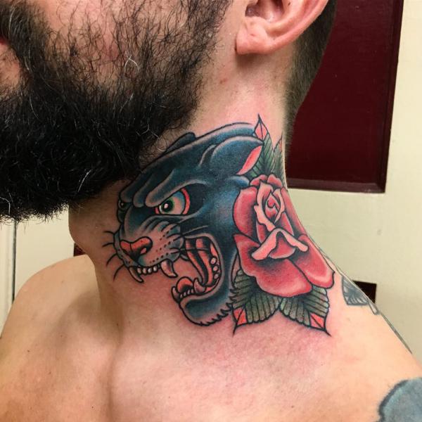 Traditional panther with rose neck tattoo