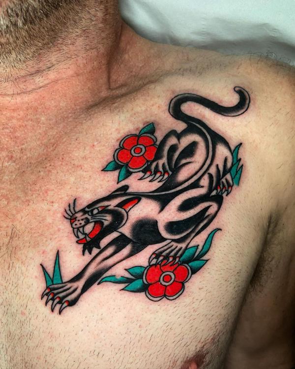Tranditional prowling panther collarbone tattoo