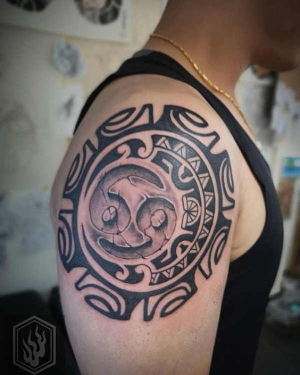 Tribal Zodiac cancer glyph stone tattoo on shoulder