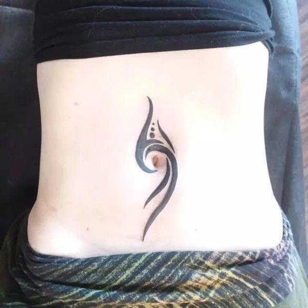 Tribal swirl belly button tattoo