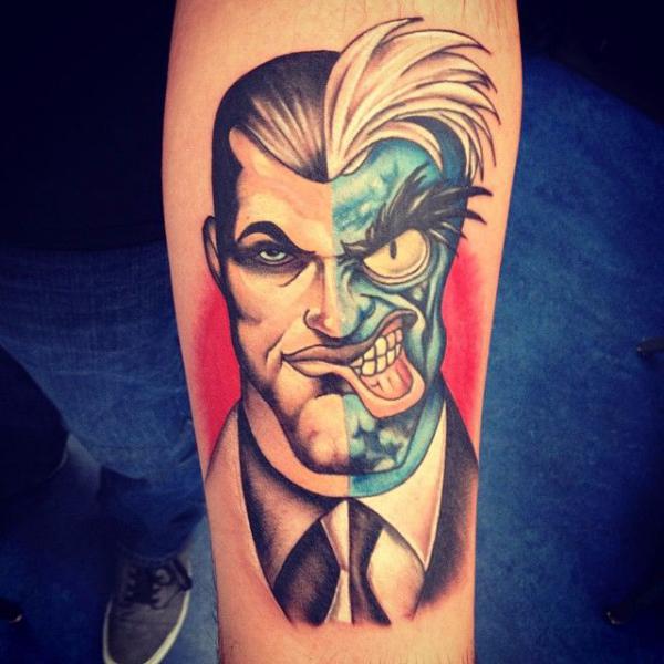 Two face joker forearm tattoo