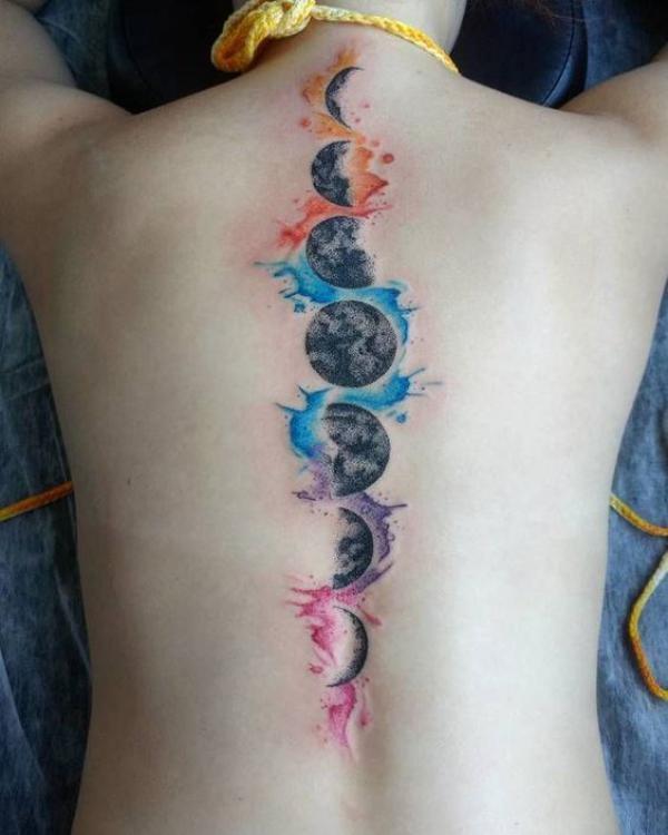 Vertical Moon phases spine tattoo