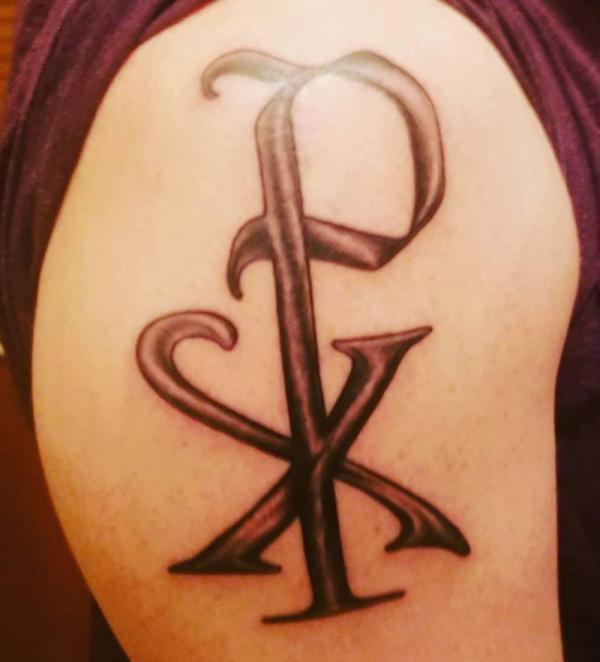 Vintage Chi Rho shoulder tattoo