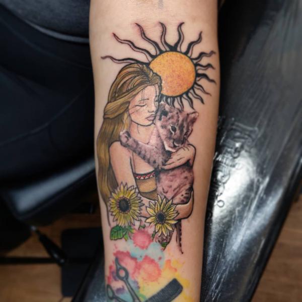 Virgo Maiden holding Leo lion cub with sun and sunflower tattoo