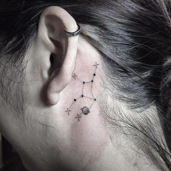 Virgo constellation tattoo behind the ear