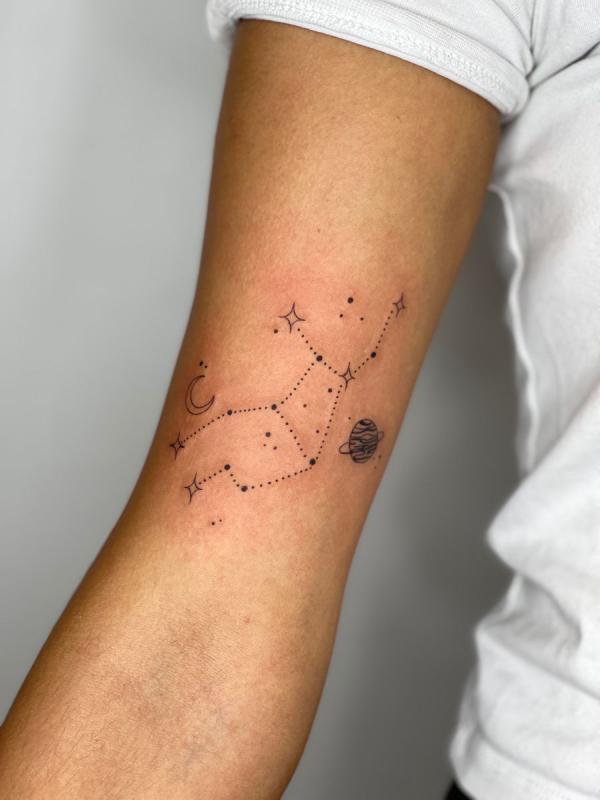 Virgo constellation with earth moon and stars tattoo