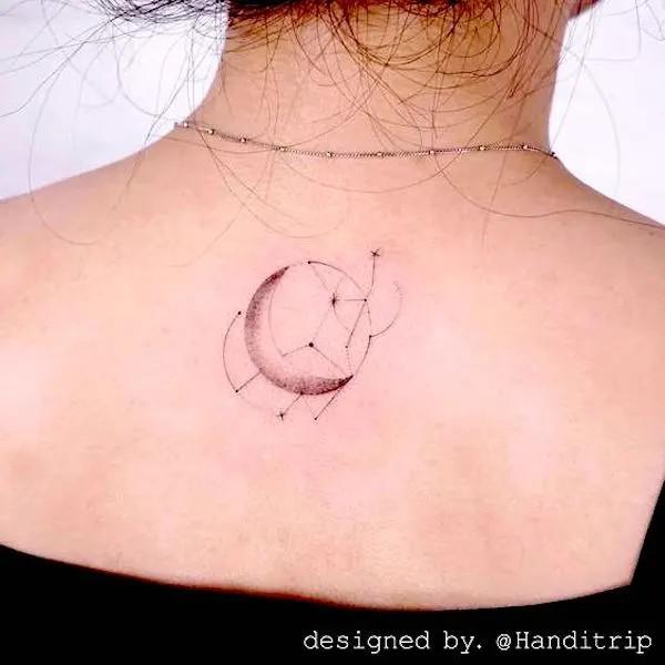 Virgo glyph and crescent moon tattoo on upper back