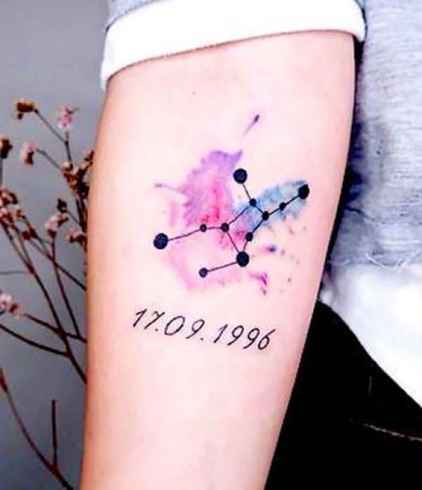 Virgo glyph on watercolor backdrop tattoo