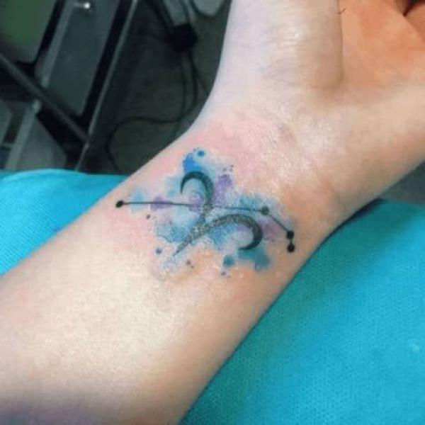 Watercolor Aries and constellation wrist tattoo