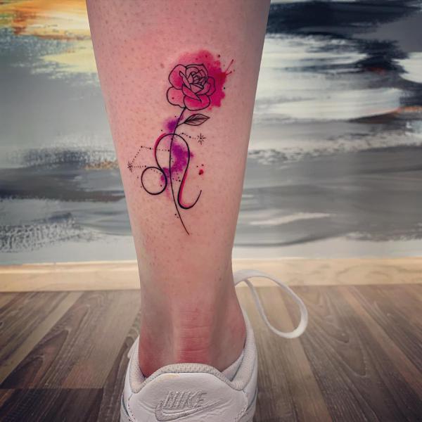 Watercolor Leo glyph with rose calf tattoo