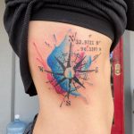 Watercolor compass with coordinates tattoo on side