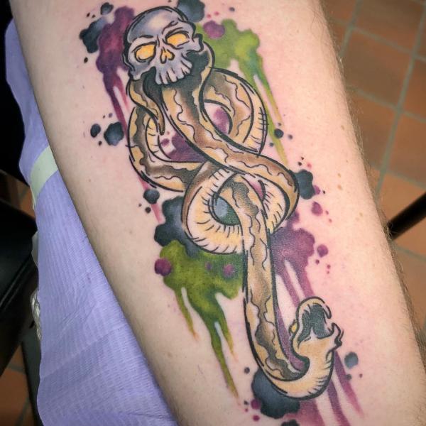 Watercolor death eater forearm tattoo