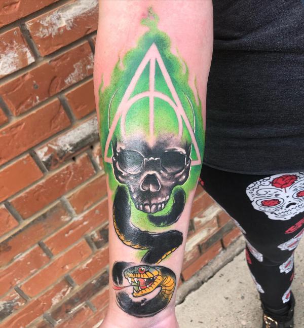 Watercolor deathly hallows and death eater forearm tattoo
