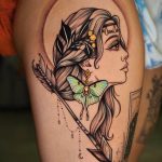 Woman with luna moth and arrow tattoo