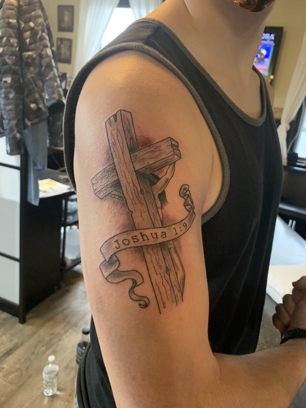 Wooden cross with Joshua 1 9 ribbon tattoo