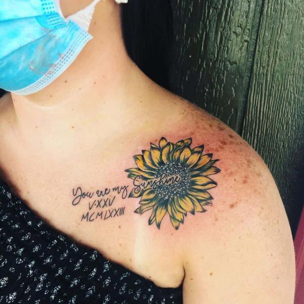 You are my sunshine sunflower shoulder tattoo with date in Roman numerals