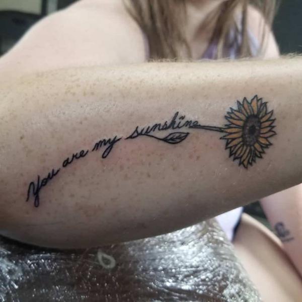 You are my sunshine sunflower tattoo on outer forearm