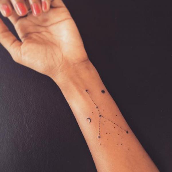 Zodiac cancer constellation with crescent moon forearm tattoo