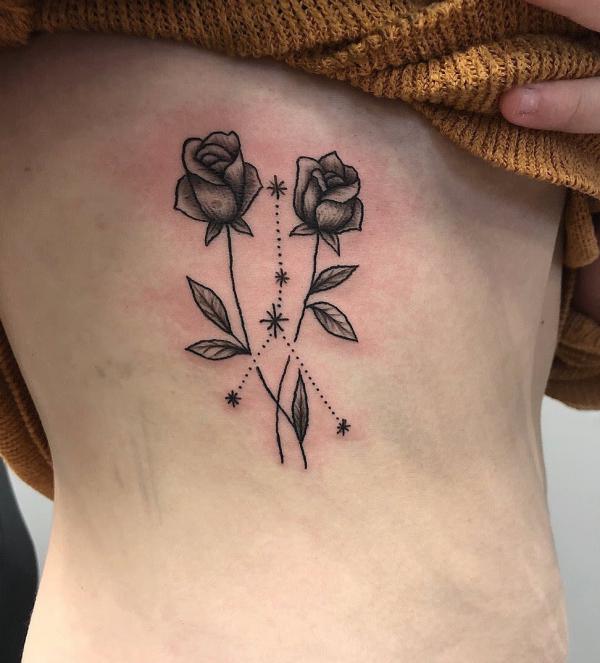 Zodiac cancer constellation with rose tattoo