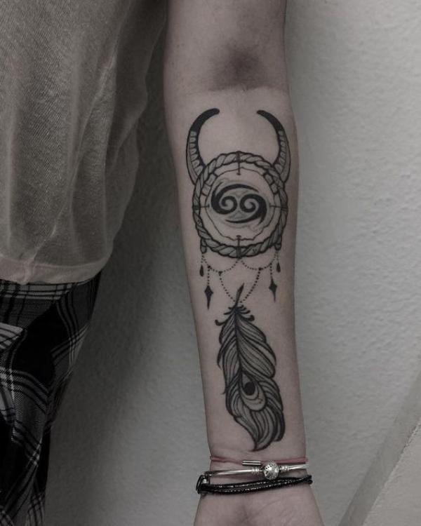Zodiac cancer dreamcatcher tattoo on forearm