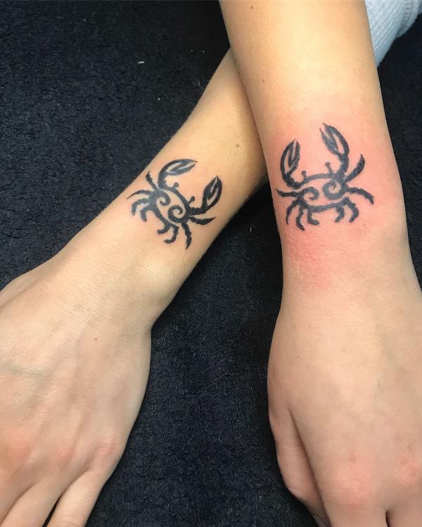 Zodiac cancer matching tattoo on wrists