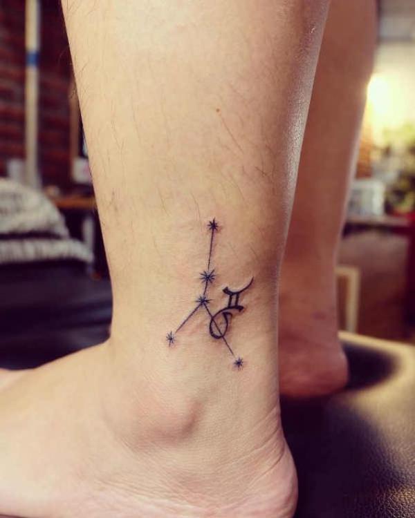 Zodiac cancer with Gemini glyph ankle tattoo