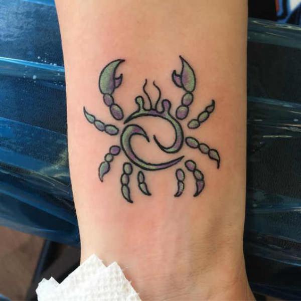 Zodiac cancer with glyph tattoo