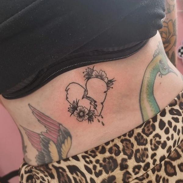 broken heart with flower tattoo