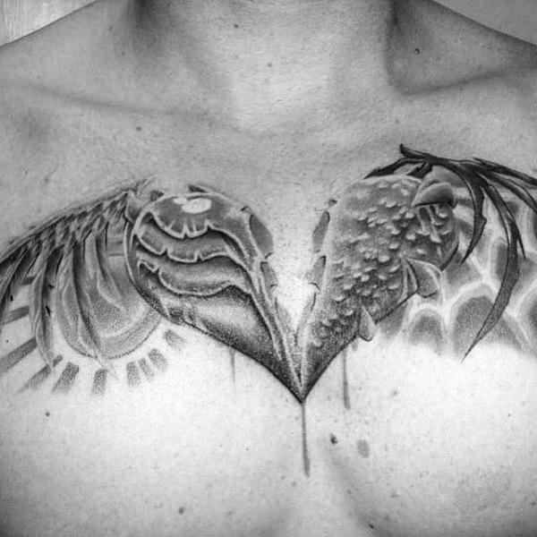 broken heart with wings chest tattoo black and grey