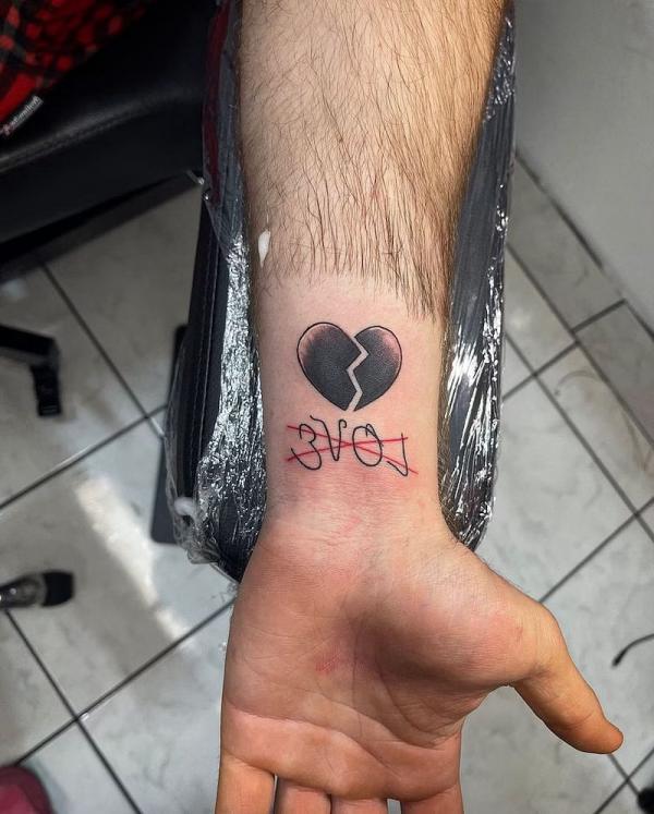 broken heart wrist tattoo