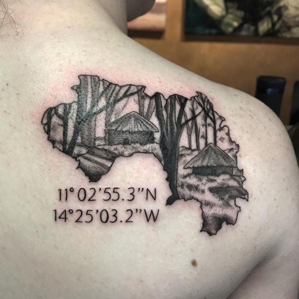 cabin and coordinates tattoo on shoulder blade