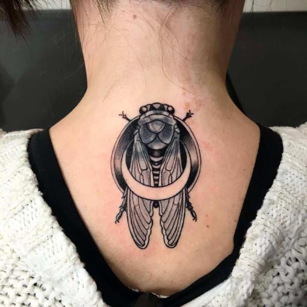 cicada with crescent moon nape tattoo